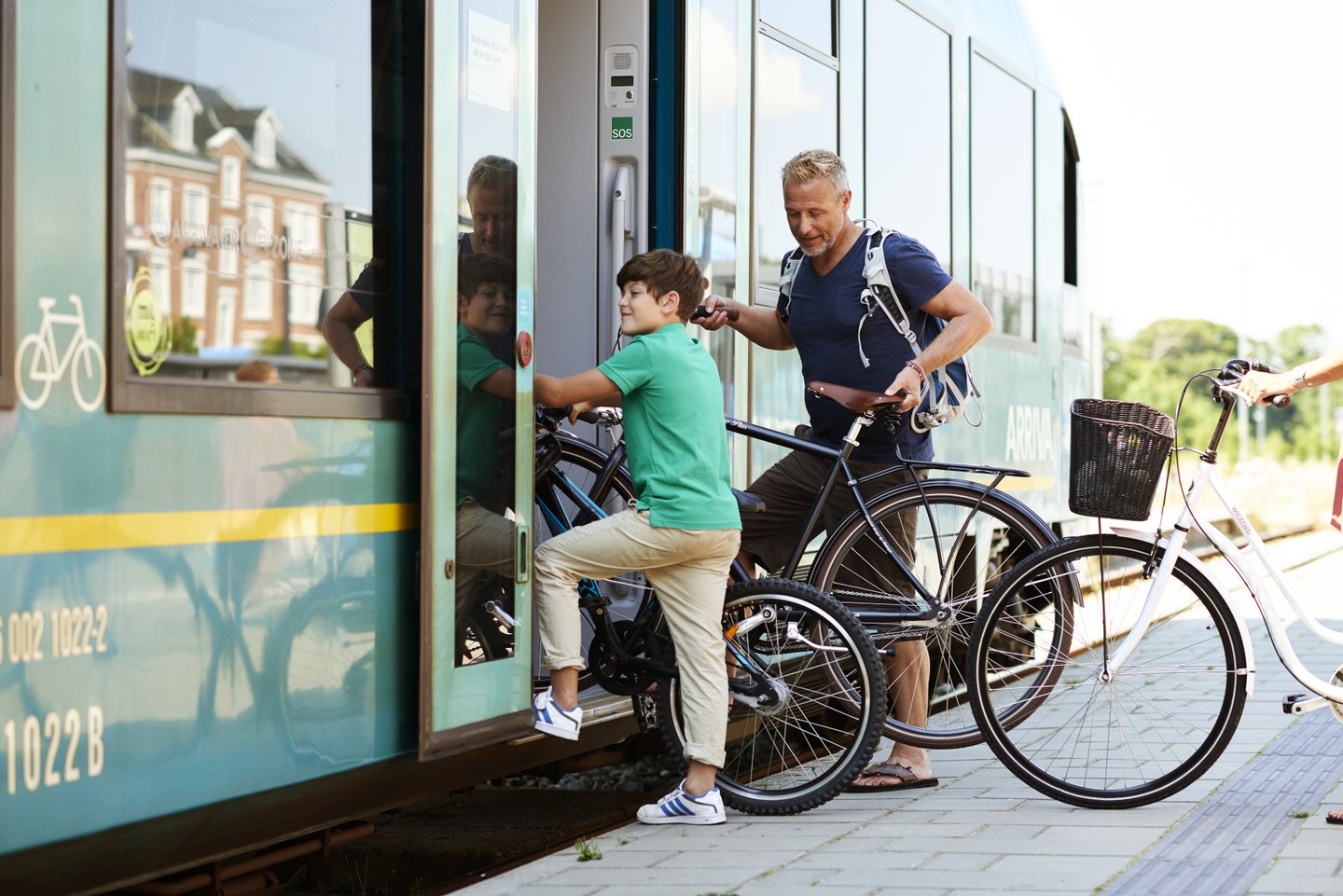 Family with bike in the train, Thisted