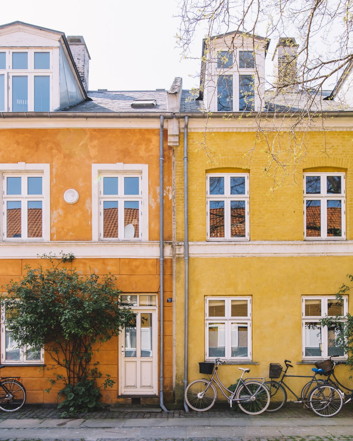 Bikes in front of colourful houses on Østerbro, Copenhagen