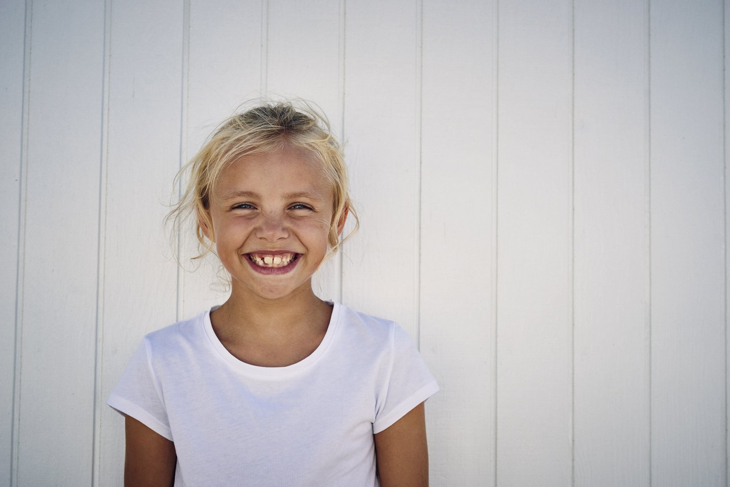 Girl smiling at beach in North Jutland, Denmark