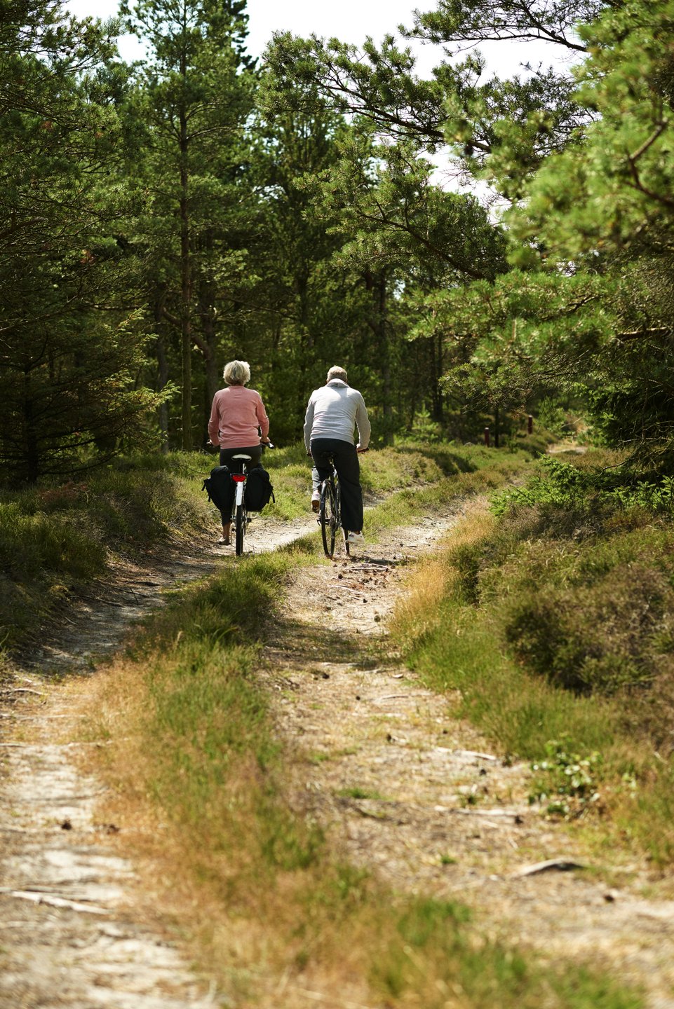 Couple cycling on a trail on Fanø