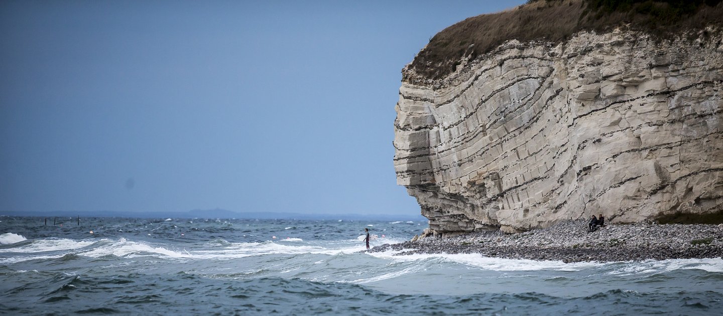 Surfer at Stevns Klint in South Zealand, Denmark