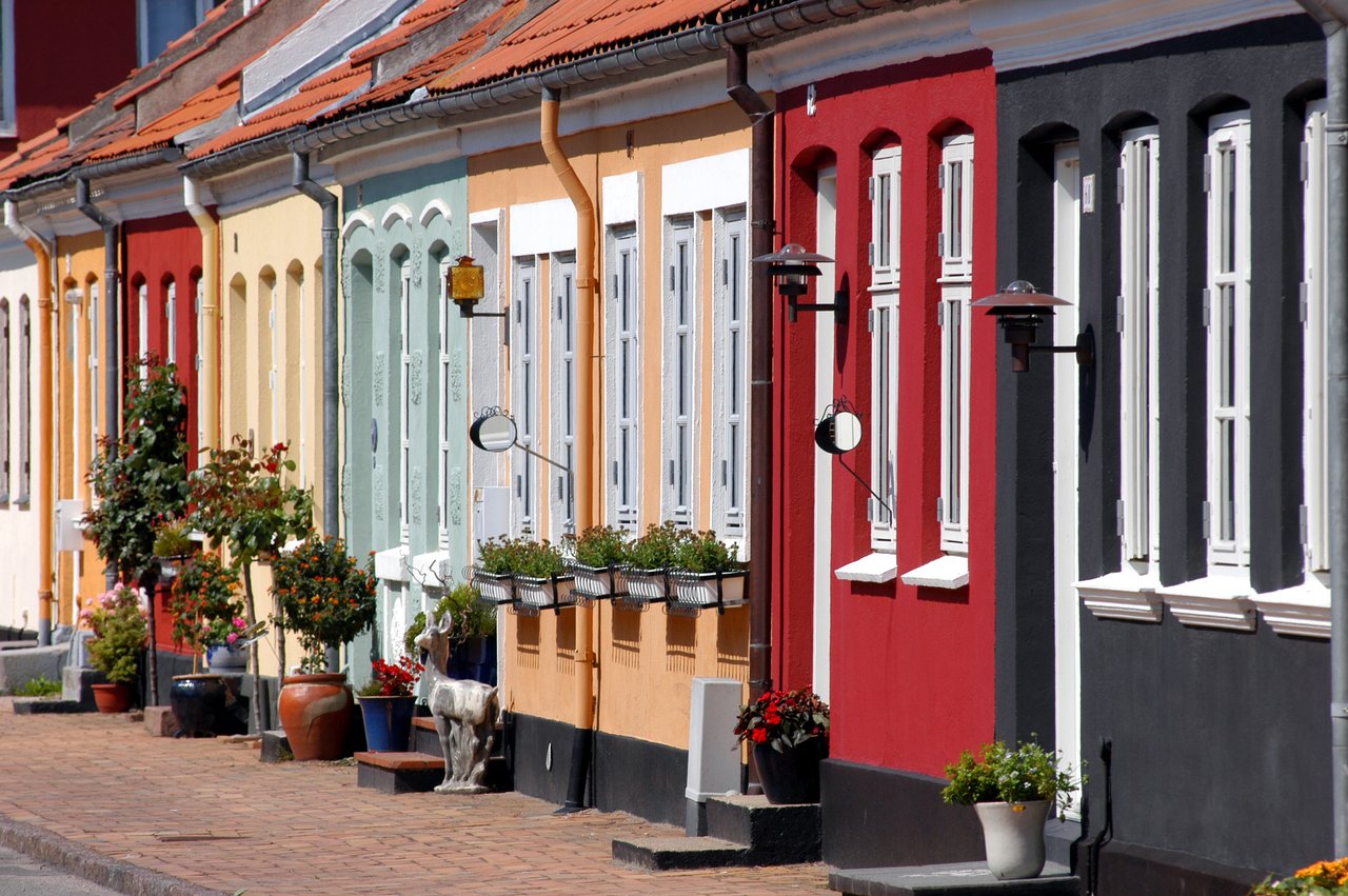 Colourful houses line a street in Fyn