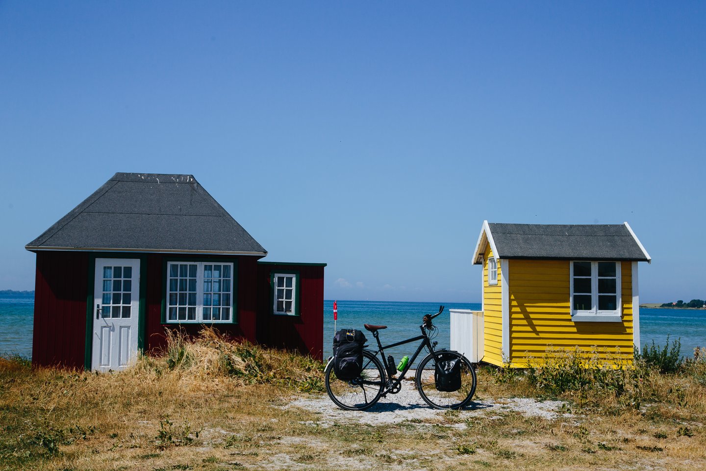 A stop by the beach cabins on Ærø while cycling the Baltic Sea Cycling Route in Denmark