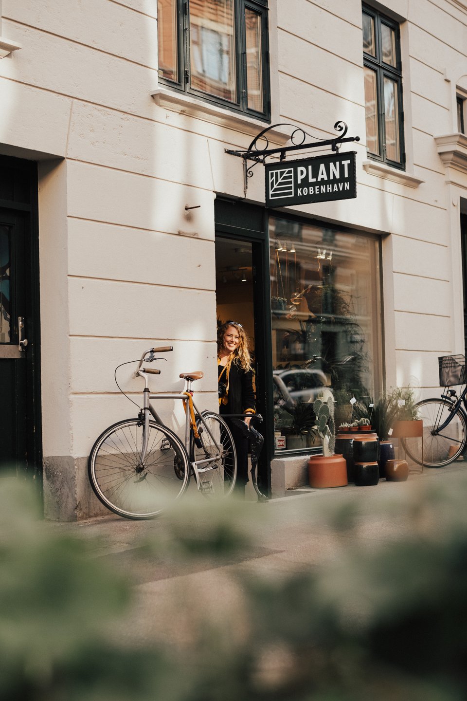 Woman shopping the plant shop in Jægerborggade, Nørrebro, Copenhagen