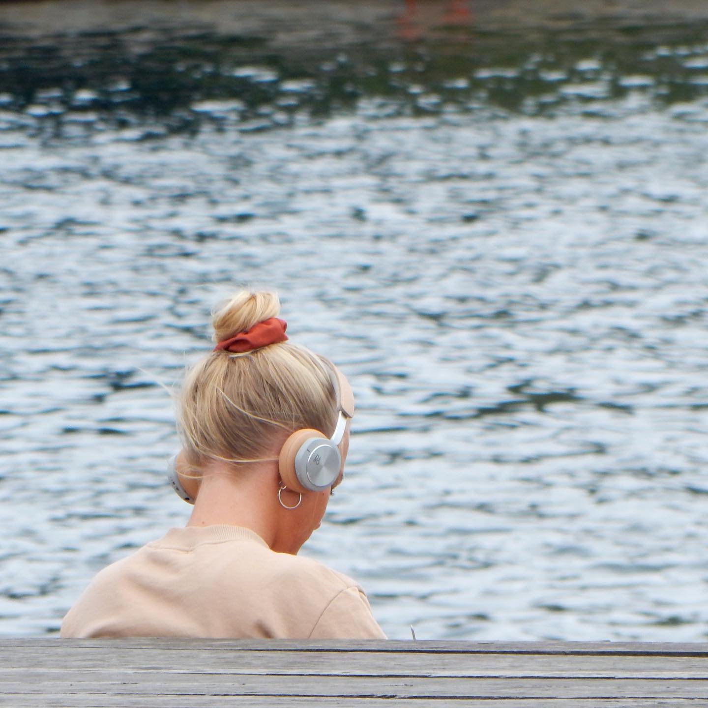 Young woman with headphones on in Copenhagen