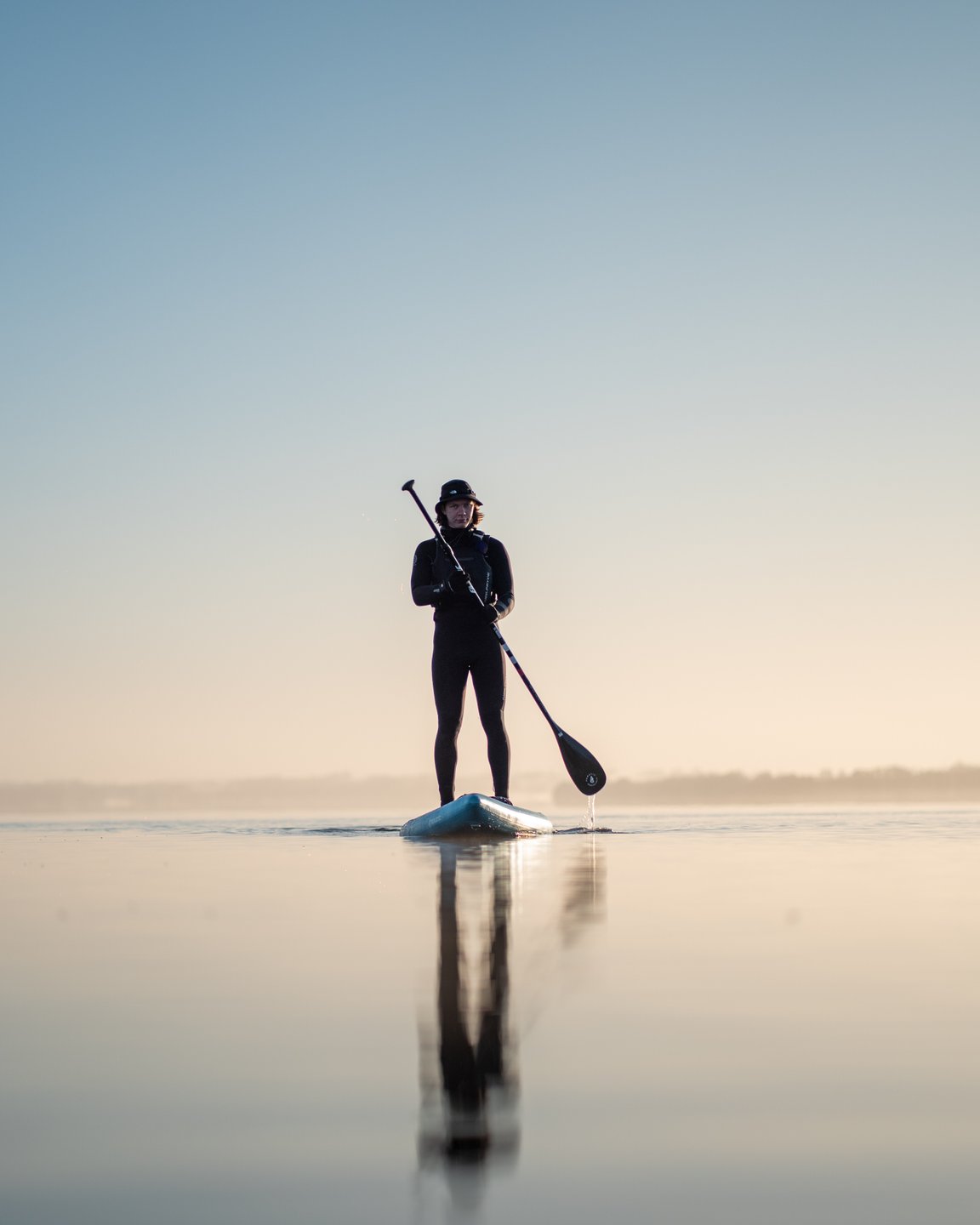 Man stand up paddling at Lynæs in North Zealand