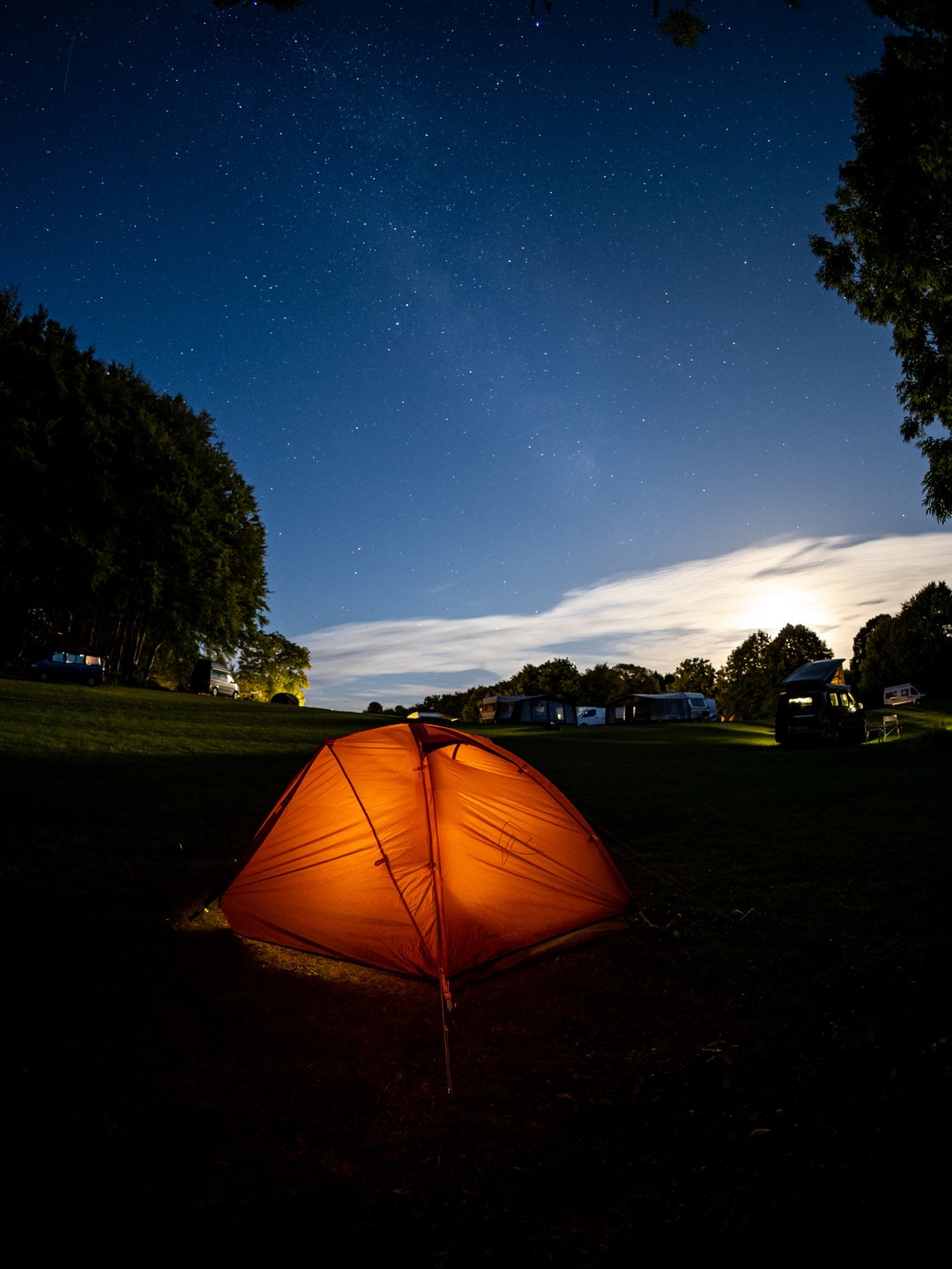 A tent pitched at Camp Møns Klint on a starry night.