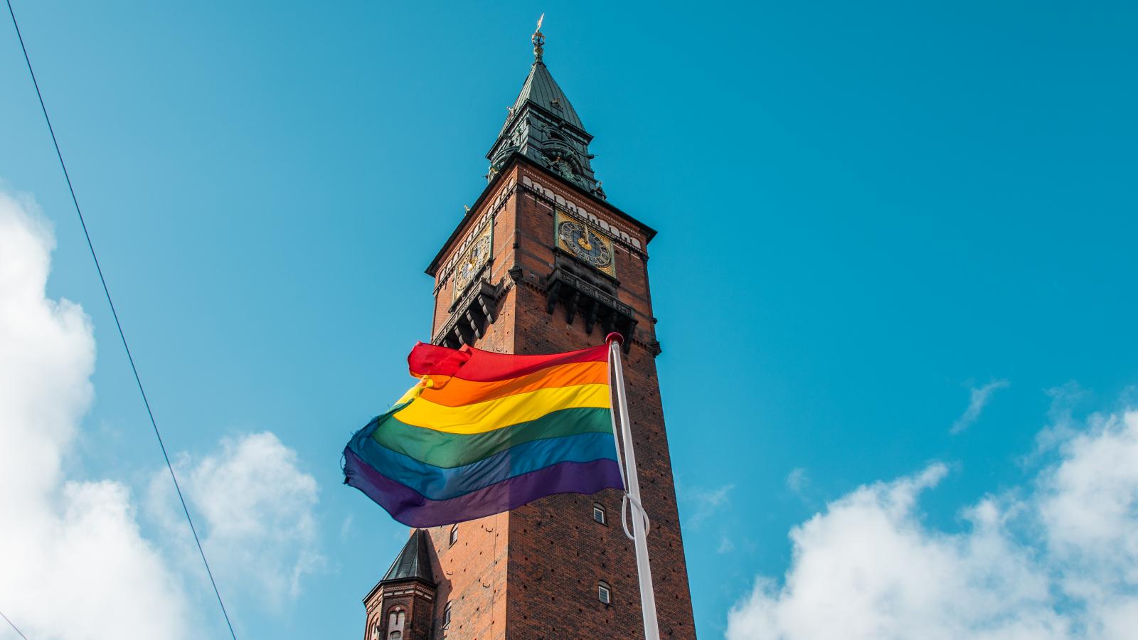 A rainbow flag flies in front of Copenhagen's City Hall to celebrate LGBTQI+ pride week