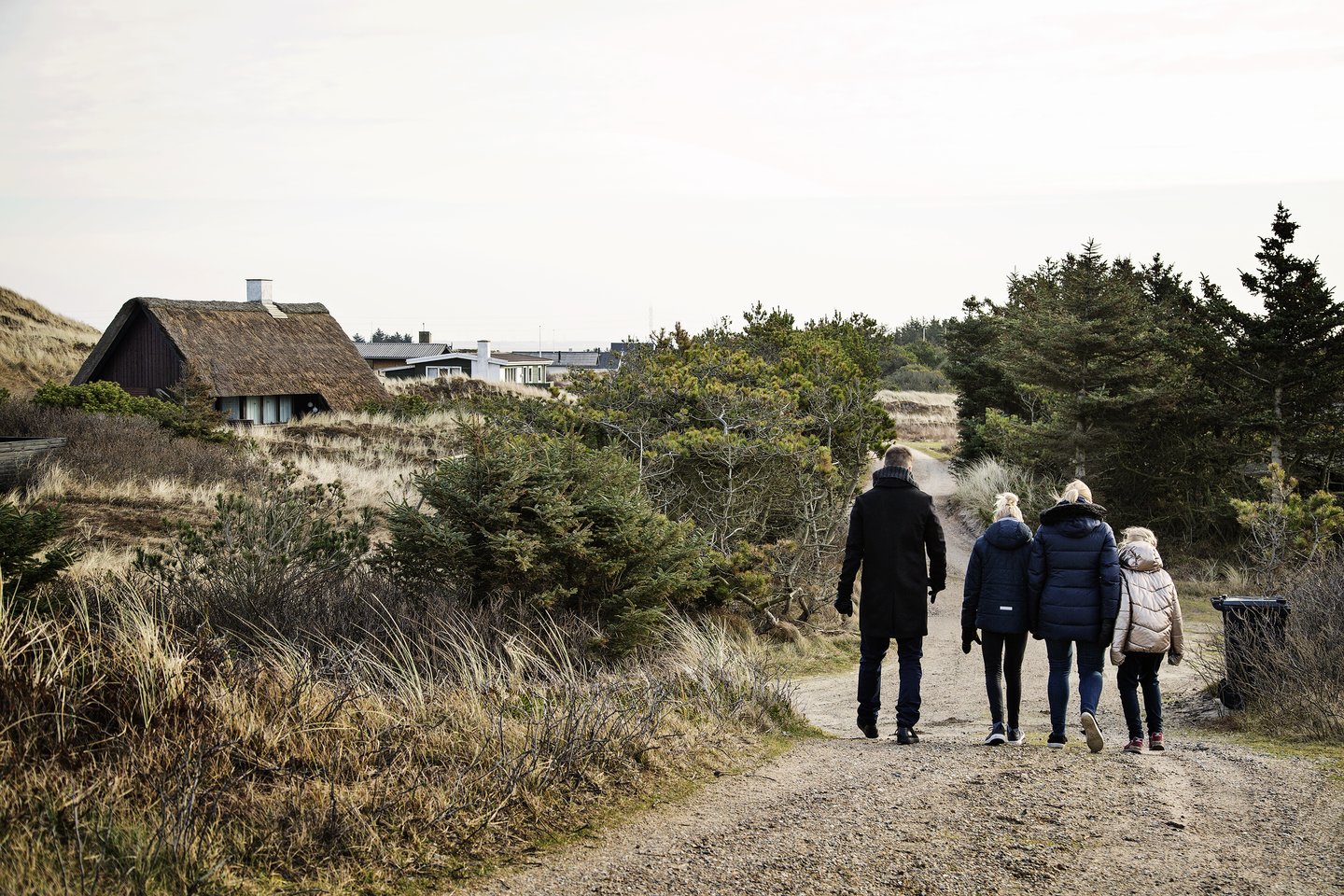 A family in a holiday cottage in Søndervig during the off-season.