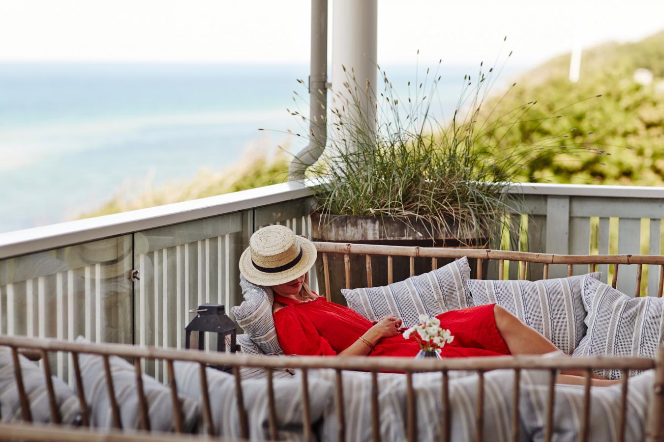 A woman relaxes at the luxury beach hotel Helenekilde Badehotel in North Zealand, Denmark