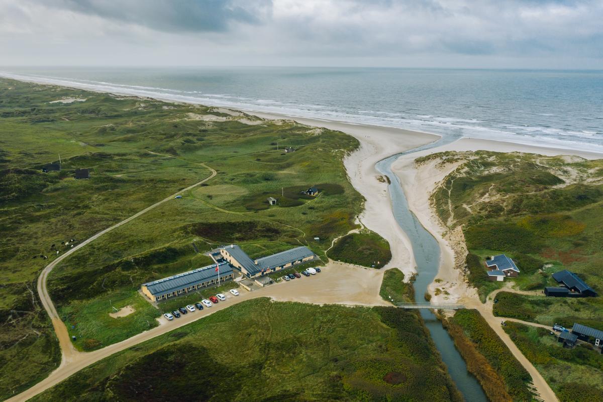 A drone view of Henne Mølle Å hotel, a beach hotel on the west coast of Denmark