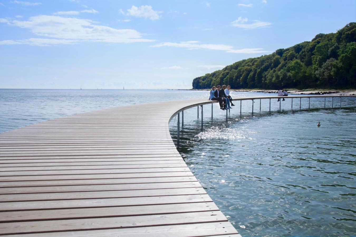 Business events delegates sitting on the Infinity bridge in Aarhus, Denmark