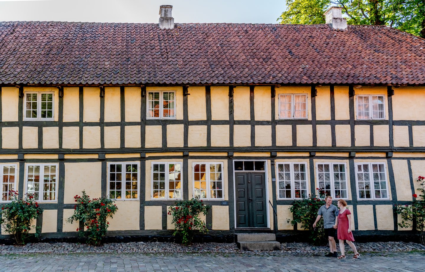 Couple walking though Mariager, Northjutland