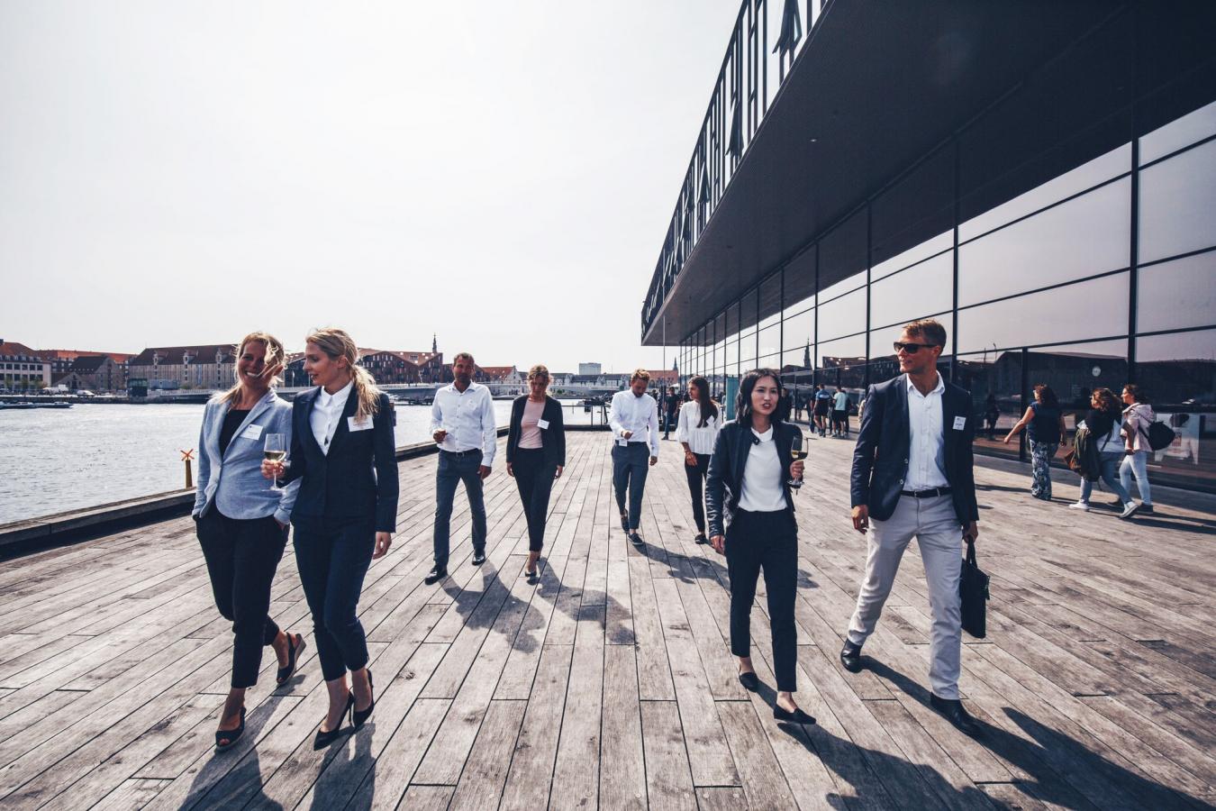 Business people in front of the Royal Playhouse Skuespilhuset, Copenhagen