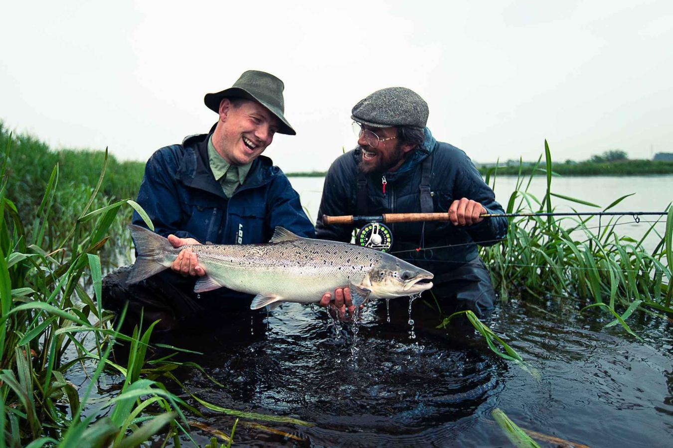 Fisher at the river Skjern A looking at a big fish