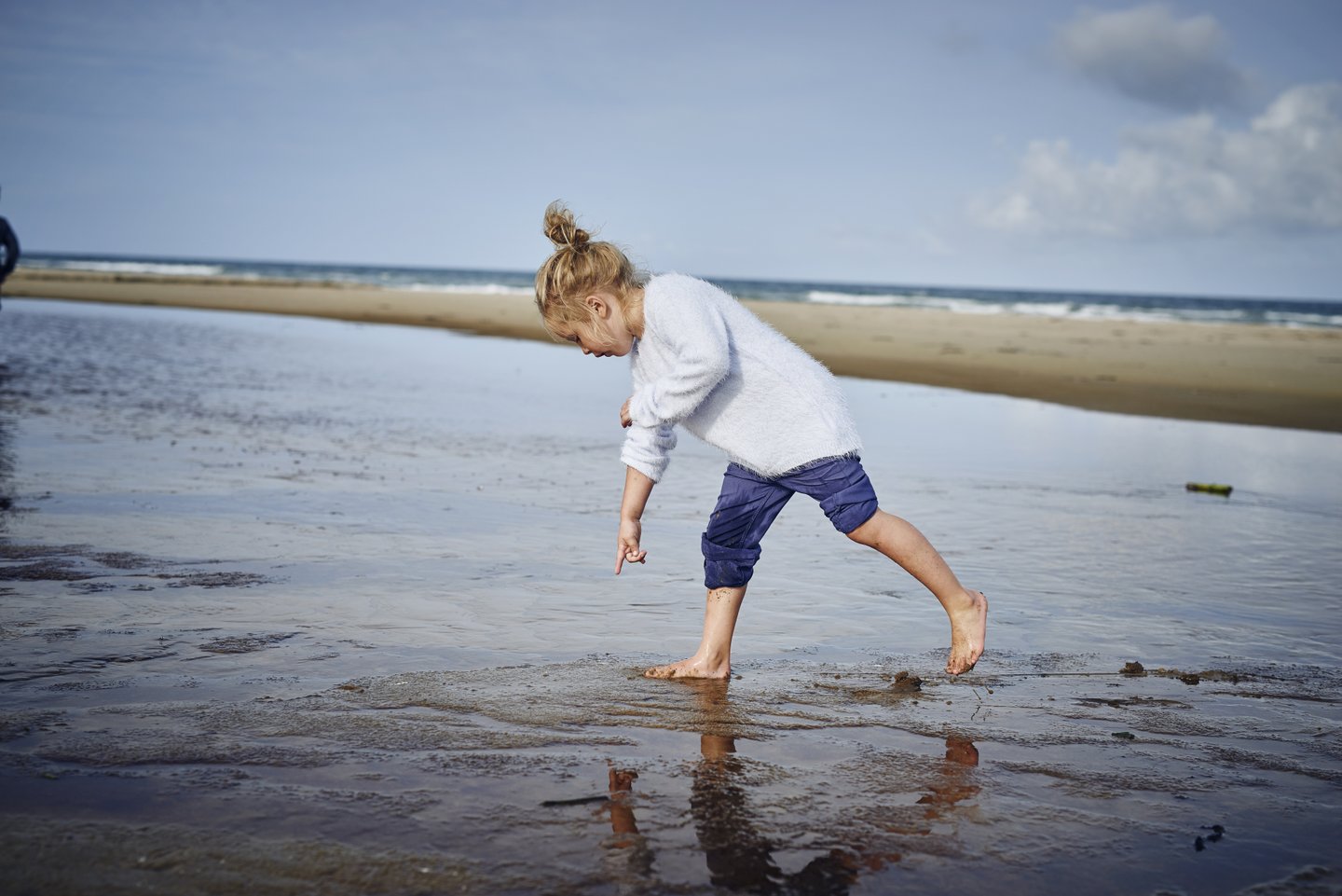 Child at Saltum Strand beach, North Jutland in Denmark