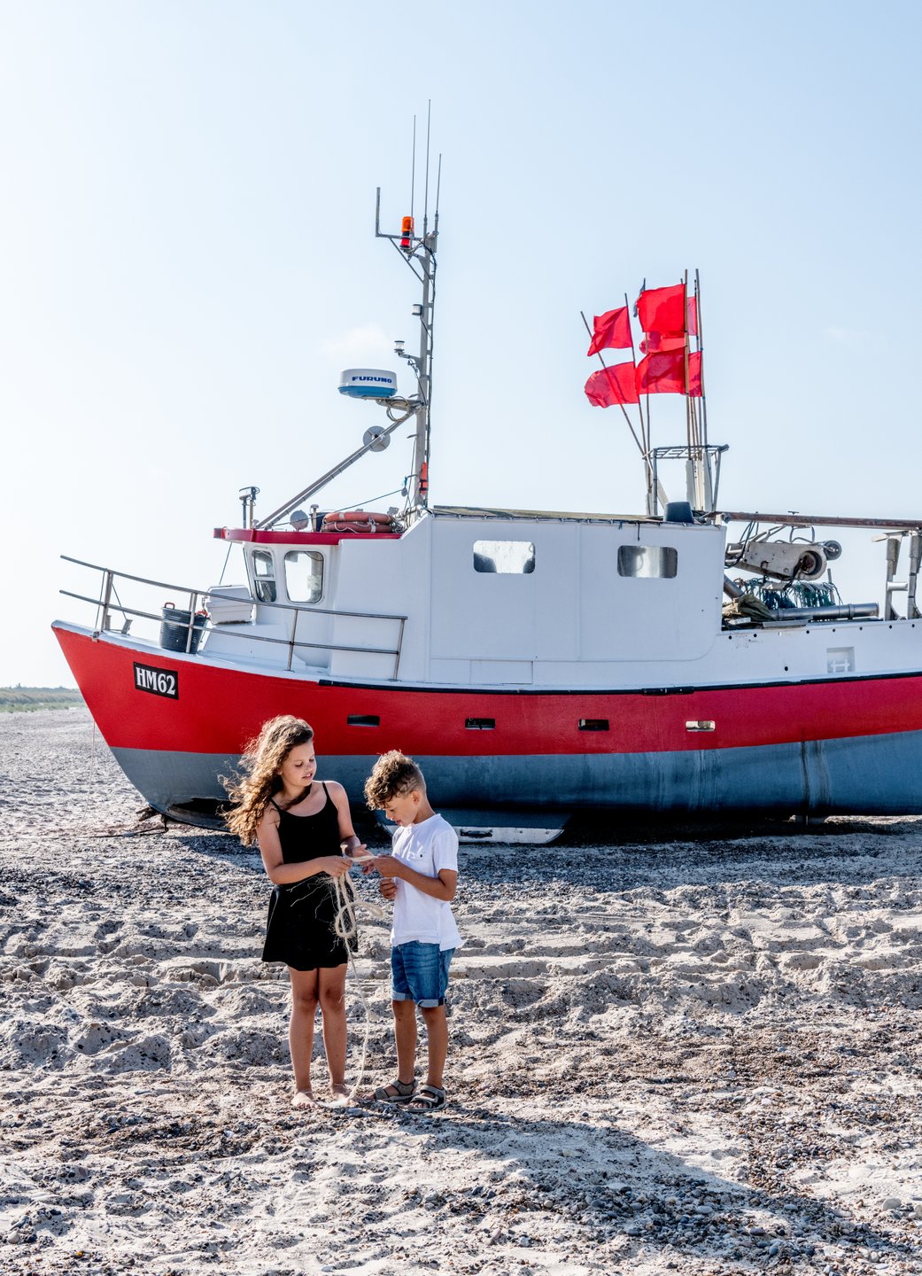 Children playing at Thorup Strand in North Jutland, Denmark