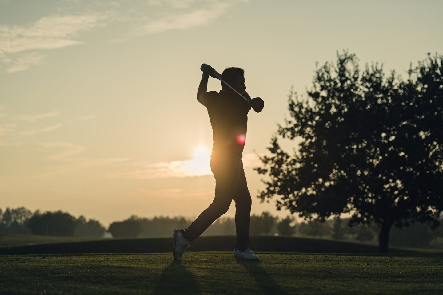 Golfing session during sunset at golf center on Møn, South Zealand