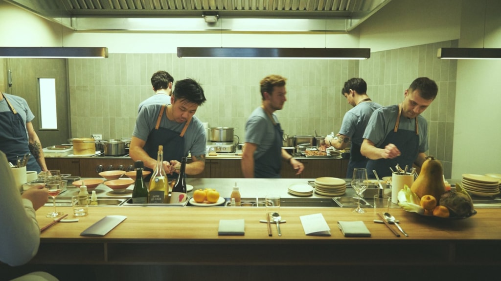 Chef plating at michelin star restaurant Jatak in Copenhagen