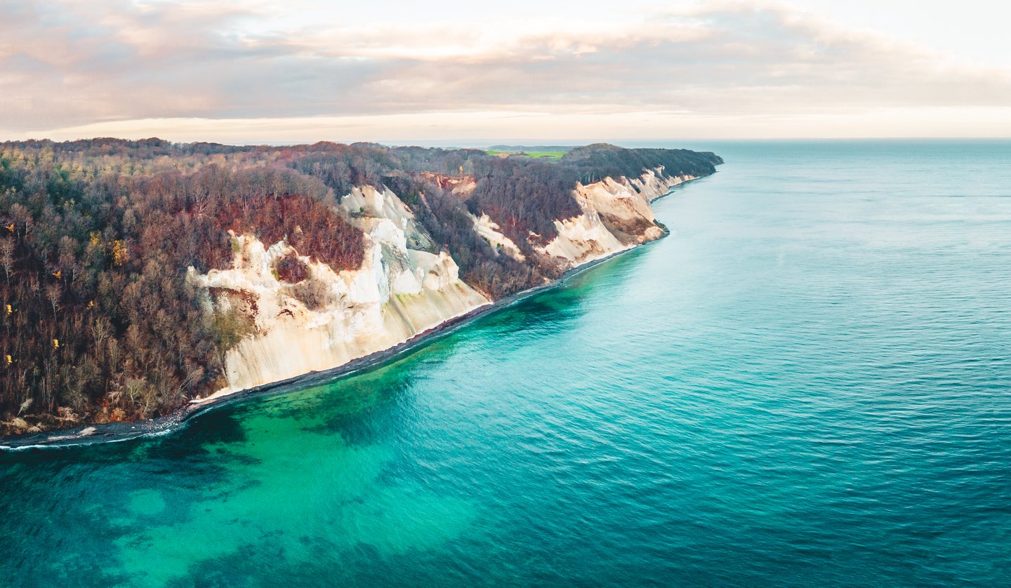 Møns Klint, a cliff in Southern Denmark, seen from above, with turquoise waters