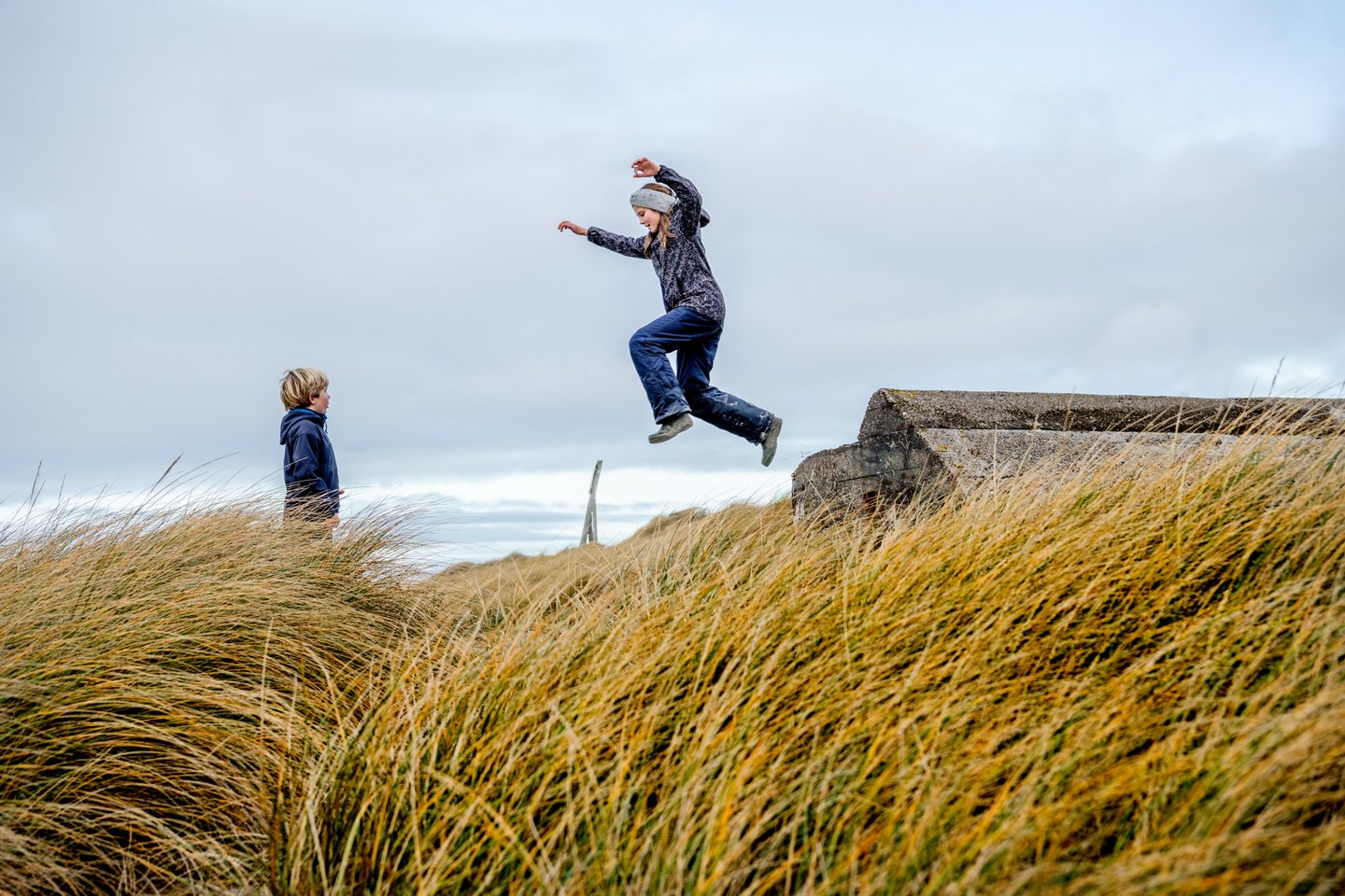 Kids plating in the sand dunes on Klitmøller, Jutland