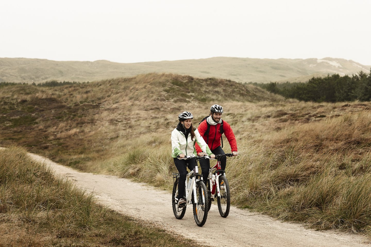 Couple biking at Holms Klit, Hvide Sande in West Jutland 