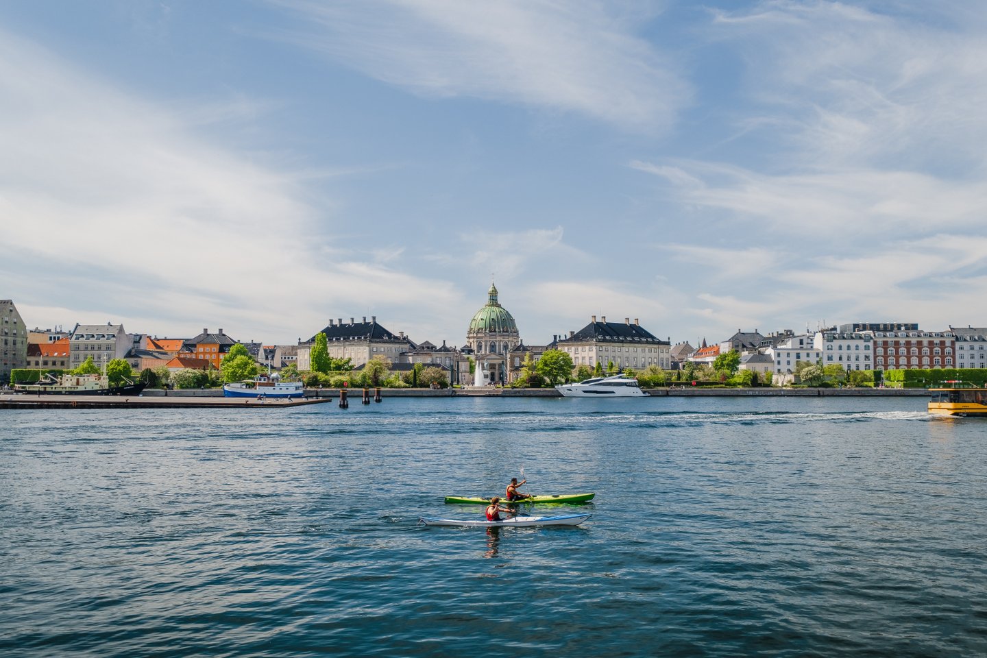 Kayaks in front of Amalienborg Castle in the harbour of Copenhagen, Denmark