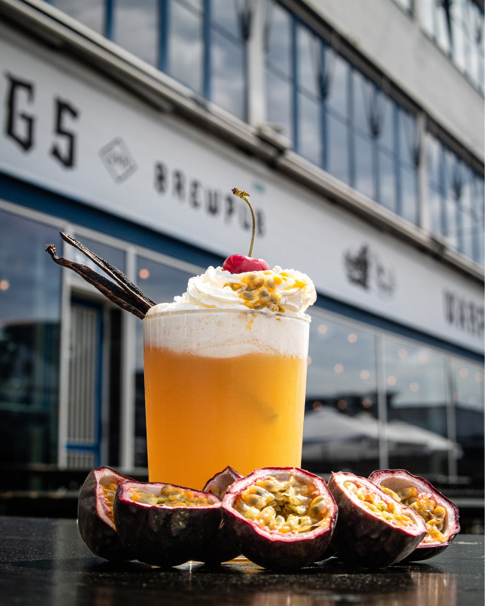 A passion fruit cocktail in front of Warpigs restaurant