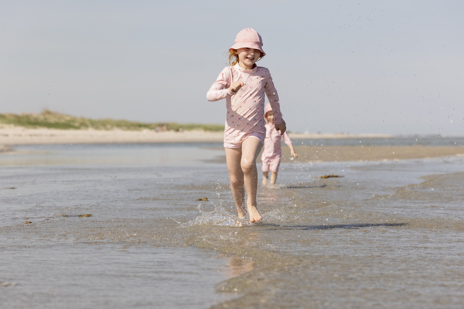 Kids playing on Hals Beach in North-Jutland, Denmark