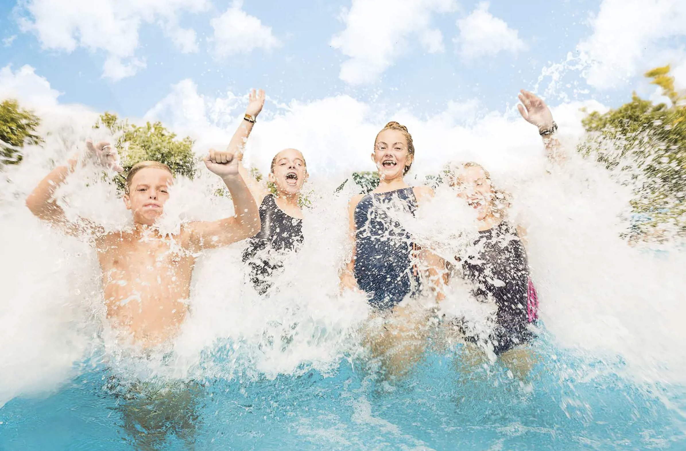 Kids playing in water in a pool