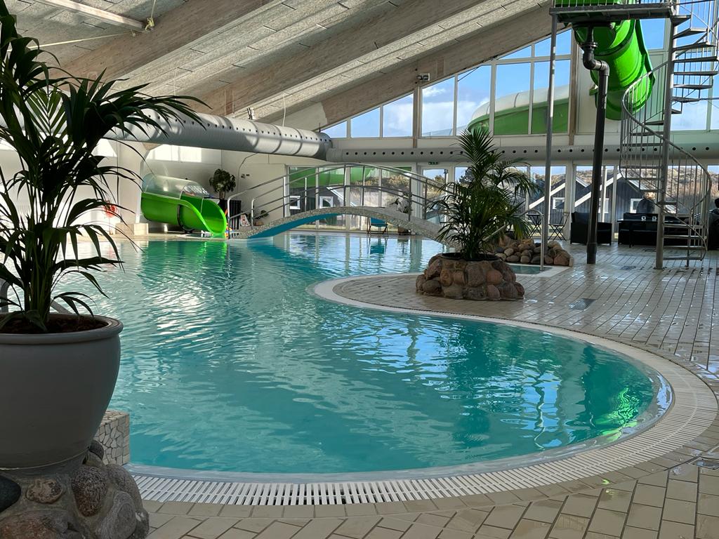 An indoor pool and a slide at Nordsø water park