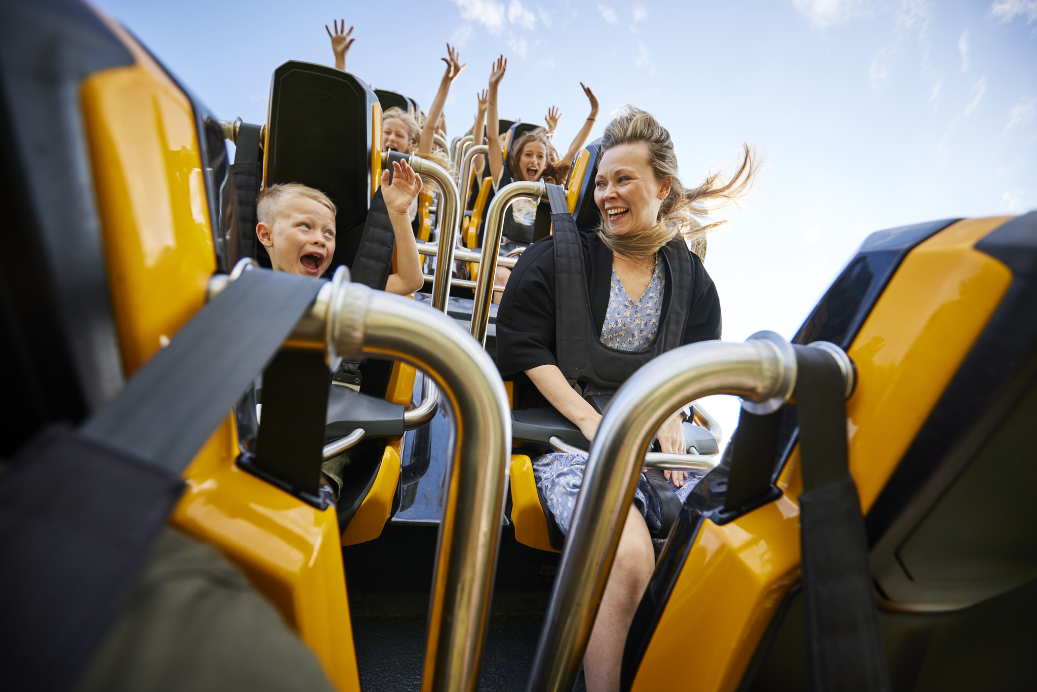 Family riding the rollercoaster Fønix in Fårup Sommerland