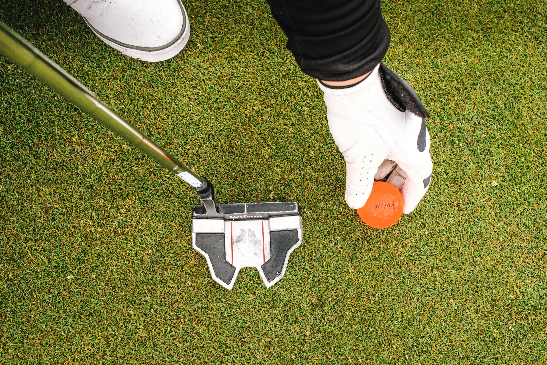 A golfer holding a golfball