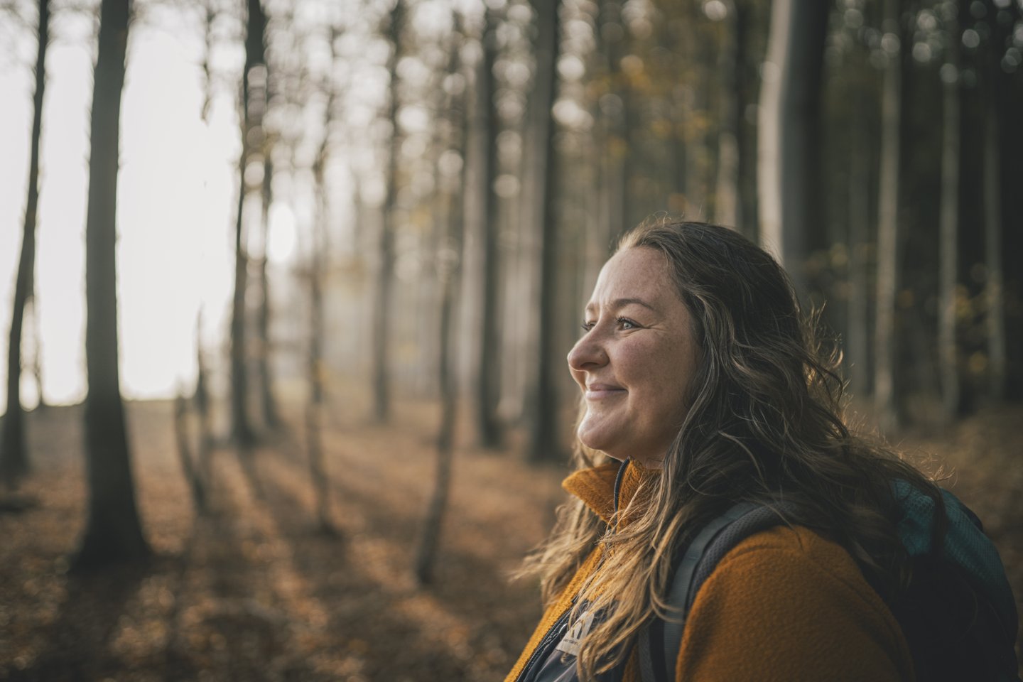 Woman hiking in a forest in Denmark