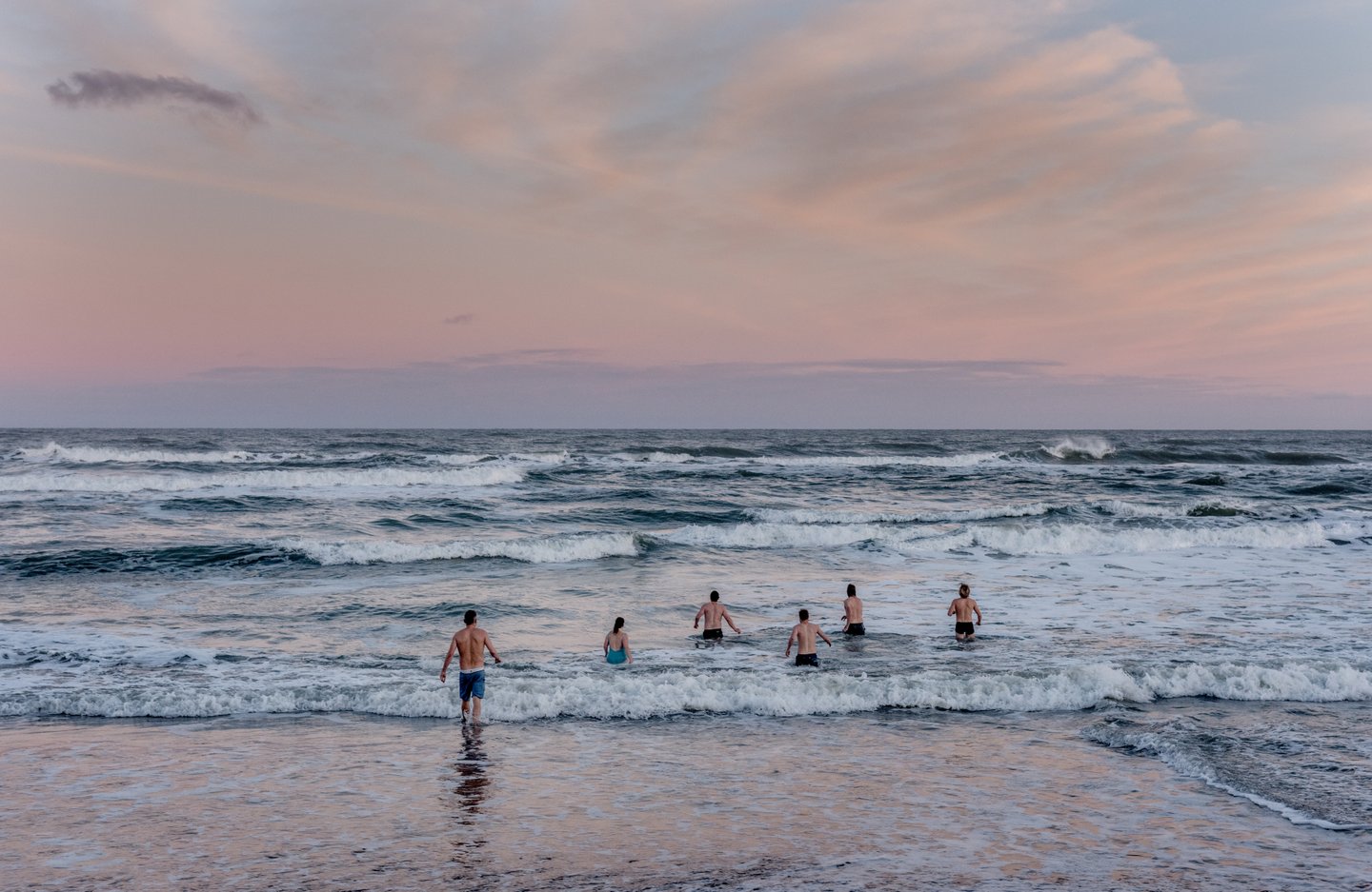 Winter bathers going into the water on a winter morning on Klitmoeller Beach in Thy, North Jutland