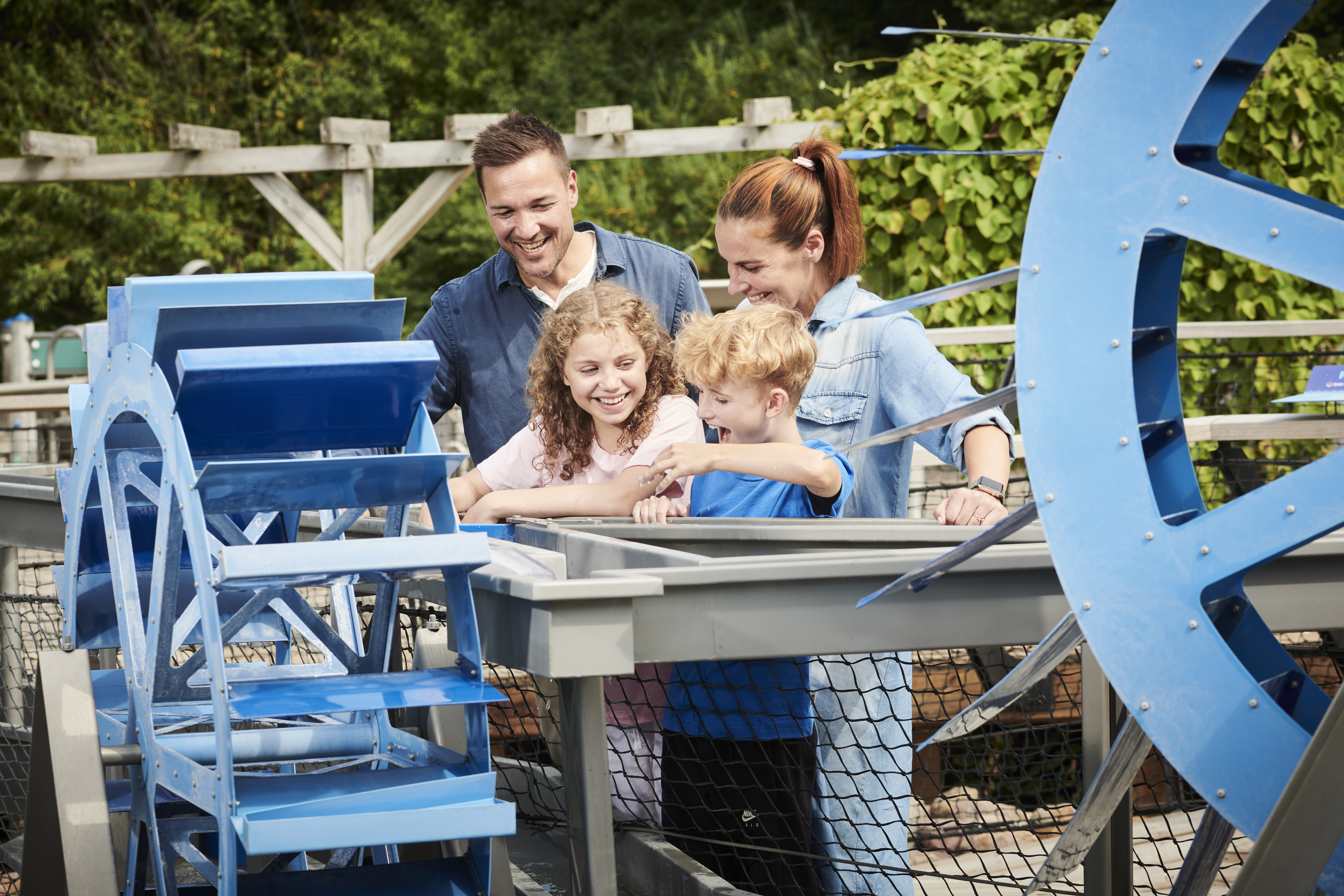 Family looking at water attraction in Universe Science Park