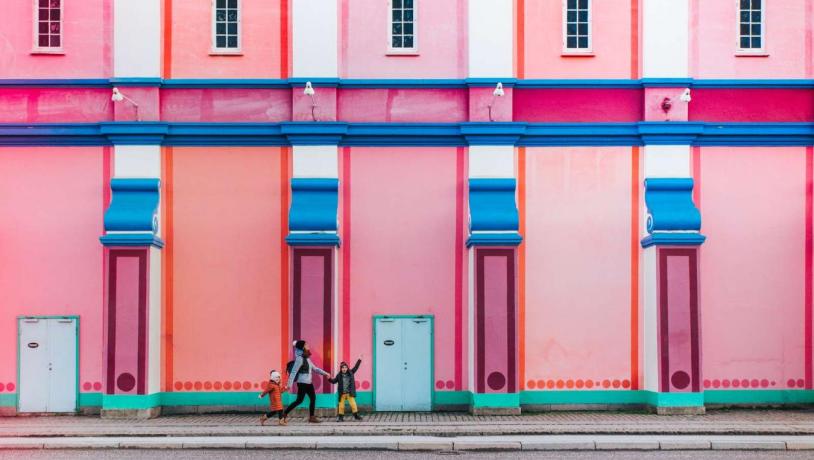 Children in front of the colourful Palads cinema in Copenhagen, Denmark