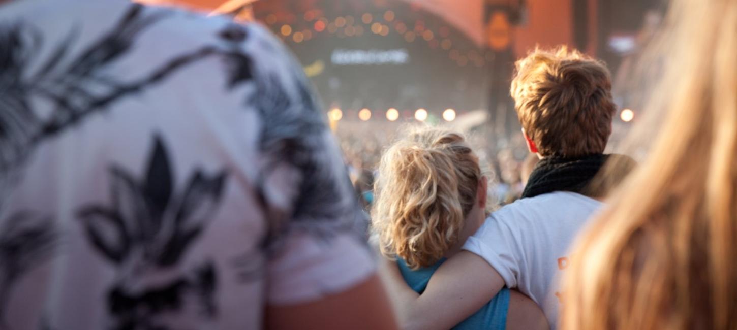 Couple in front of Orange Stage at Roskilde Festival