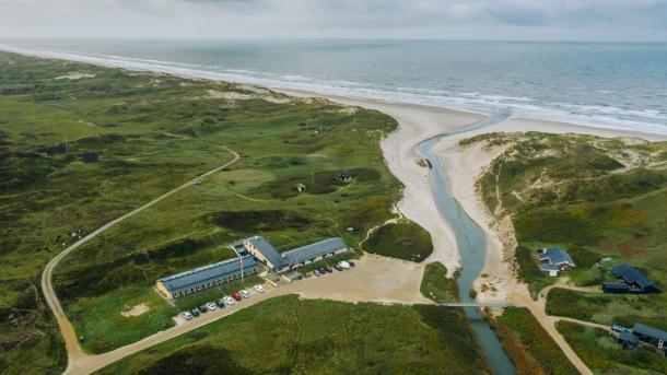 A drone view of Henne Mølle Å hotel, a beach hotel on the west coast of Denmark