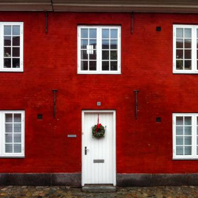 Red building with Christmas wreath in Copenhagen