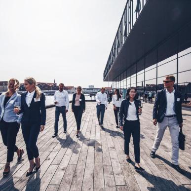 Business people in front of the Royal Playhouse Skuespilhuset, Copenhagen