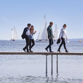 Business people walking on Aarhus infinite bridge