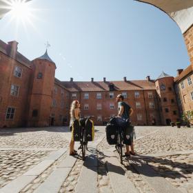 Couple with bikes at Sønderborg Castle, South Jutland