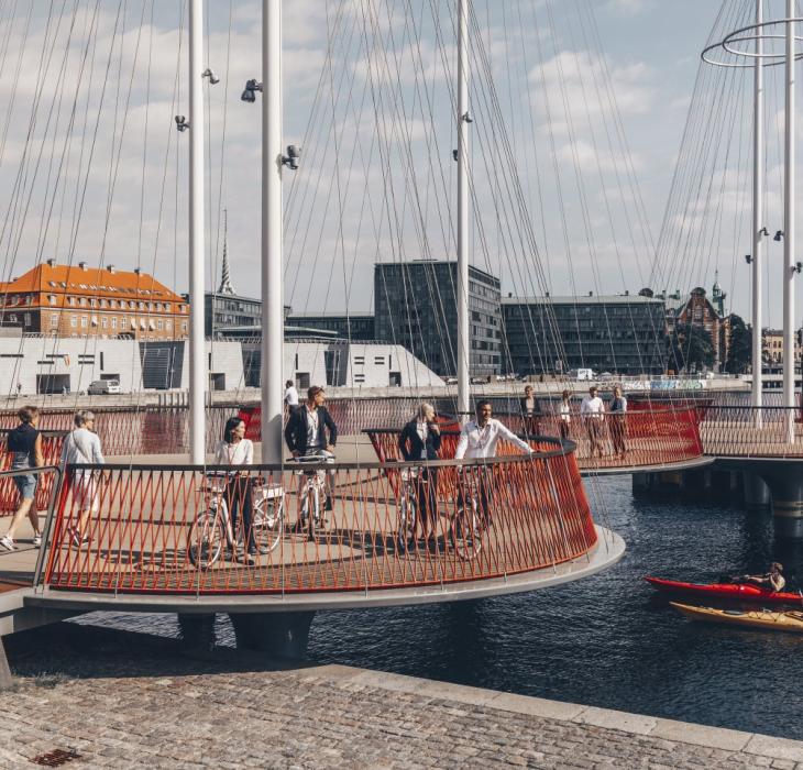 Business people with bikes on the circle bridge in Copenhagen